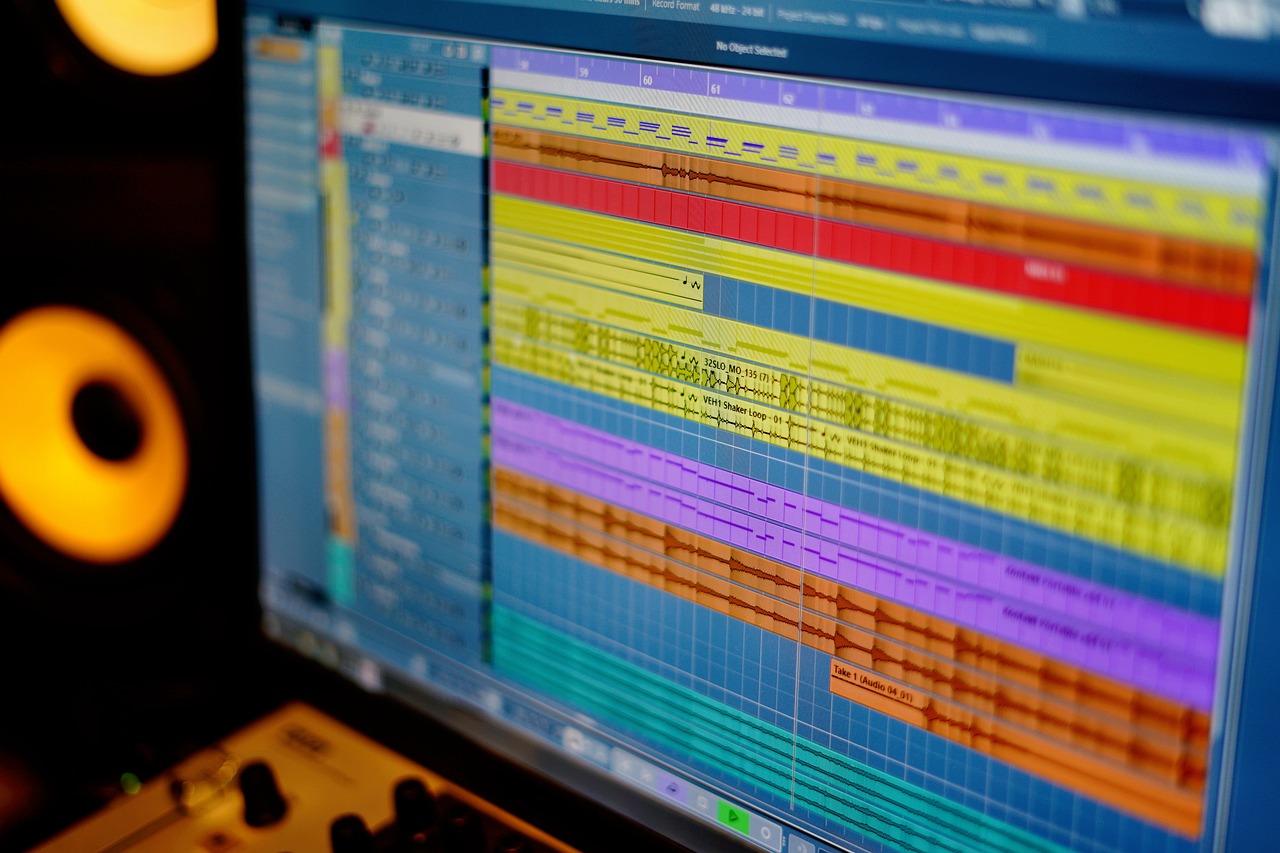 Colorful and dynamic interface of a digital audio workstation (DAW) software, displaying waveforms, controls, and visual elements associated with music production